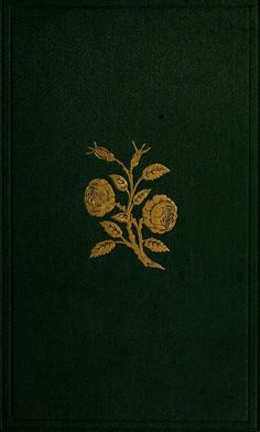 a green book with gold flowers on it