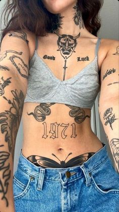 a woman with many tattoos on her chest