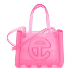 This is an authentic TELFAR x MELISSA Jelly Small Shopping Bag in Clear Pink.This chic water-resistant tote is crafted of clear PVC with the iconic Telfar logo at the front. The shoulder bag features short top handles, and two long shoulder straps. The top opens toa matching plastic interior. Clear Telfar Bag, Telfar Bag Pink, Jelly Telfar Bag, Pink Telfar Bag, Pink Telfar Bag Aesthetic, Telfar Bags, Telfar Small Shopping Bag, Girly Bags, Small Bags