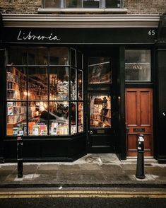 a store front with many books in the window