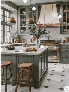 a large kitchen with lots of counter space and stools in front of the island