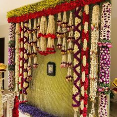 a room decorated with flowers and beads