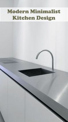 modern minimalist kitchen design with stainless steel sink and faucet in the center