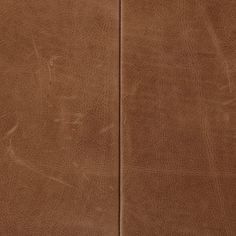 the back side of a brown leather chair