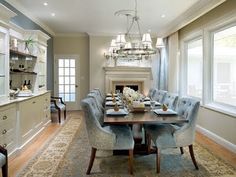 a large dining room table with blue chairs