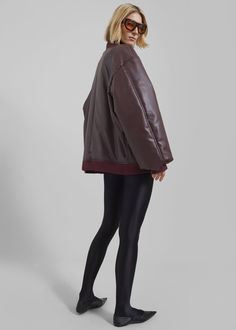 Astra Faux Leather Bomber Jacket - Burgundy – The Frankie Shop Fall Outerwear With Contrast Collar For Work, Fall Workwear Outerwear With Contrast Collar, Fall Leather Jacket With Contrast Collar, Brown Workwear Outerwear With Ribbed Cuffs, Fall Brown Outerwear With Contrast Collar, Chic Fall Outerwear With Ribbed Collar, Chic Outerwear For Work With Ribbed Cuffs, Oversized Outerwear With Ribbed Collar, Versatile Brown Outerwear For Work