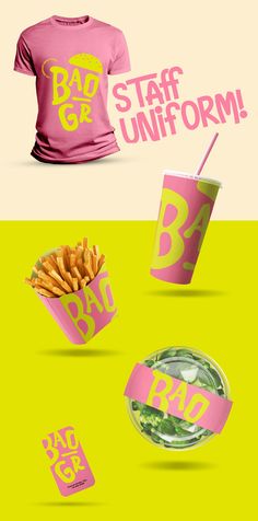 the pink shirt is next to some fries and a cup with a straw in it