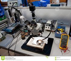 a microscope and other electronic equipment on a table