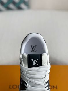 Embrace iconic style with these LV Trainer-inspired sneakers, showcasing a striking black and white colorway. The premium leather construction is adorned with the subtle yet distinctive Louis Vuitton monogram, adding a touch of luxury. The clean lines and classic trainer silhouette offer a versatile and timeless appeal, perfect for both casual outings and elevated ensembles. Black Trainer, Black Trainers, Loafer Sneakers, Bottega Veneta Shoulder Bag, Iconic Style, Trainer Sneakers, British Indian Ocean Territory, Loafer Shoes, Louis Vuitton Monogram