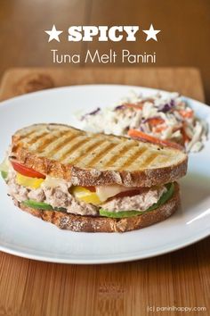 a grilled sandwich with tuna, lettuce and tomato