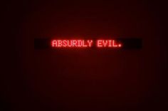 a red neon sign that says destroy evil in the middle of it's dark room