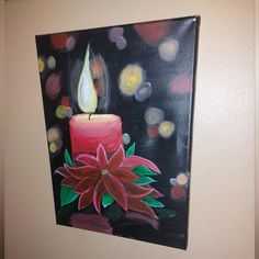 a painting of a lit candle with a poinsettia flower on the side