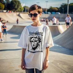 Discover a unique blend of classical art and modern street style with our 'Vandalism Art Style T-Shirt.' This eye-catching design features the iconic David statue adorned with graffiti, giving it a bold, rebellious edge. Perfect for art enthusiasts and fashion-forward individuals alike, this t-shirt makes a statement with its intricate details and high-quality print. Crafted from soft, breathable fabric, this t-shirt ensures maximum comfort and durability. Whether you're heading out for a casual day or looking to stand out at an event, this t-shirt is your go-to choice. Embrace the fusion of art and fashion with our 'Vandalism Art Style T-Shirt' and express your unique style effortlessly. Soft, comfortable fabric High-quality print Unique David statue graffiti design Perfect for casual wea Artistic Oversized T-shirt For Streetwear, Artistic Streetwear Summer Tops, Artistic Summer Streetwear Tops, Artistic Summer Tops For Streetwear, Artistic Summer Streetwear T-shirt, Artistic Summer T-shirt For Streetwear, Artistic Graphic T-shirt For Streetwear, Artistic Graphic Print T-shirt For Streetwear, Artistic White Tops For Streetwear