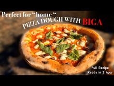 a pizza sitting on top of a pan covered in cheese and toppings with the words perfect for home's pizza dough with biga