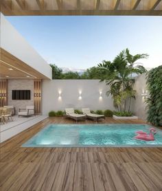 an indoor swimming pool with a pink flamingo in the center and lounge chairs around it