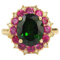 Natural Green Diopside Multi-Halo Cluster 3.40ct Oval, Full cut Brilliant Natural Diopside 11.4 x 9mm Clean Clarity & Transparent. Prime Vivid Deep Green 1.60ct Natural round Rubies. Clean Clarity & Transparent. .30ct Round diamonds Fancy Yellow color / Vs-2 clarity. 14kt. yellow gold 6.1 grams Ring Current size: 7.5 Deck of ring: 17 x 16.3mm Depth: 8.8mm (Free Resize Service, Please inquire) $6000 Appraisal will accompany Pear Wedding Ring, Charles And Colvard Moissanite, Diamond Cluster Earrings, Fancy Yellow Diamond, Yellow Diamonds, Ruby Diamond Rings, Cluster Rings, Diamonds Ring, Bridal Ring Set