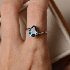 London blue topaz ring pear cut blue gemstone sterling | Etsy Elegant Sterling Silver Pear-shaped Topaz Ring, Elegant Pear-shaped Topaz Ring In Sterling Silver, Elegant Teardrop Topaz Ring In Sterling Silver, Fine Jewelry Blue Topaz Teardrop Rings, Pear-shaped Topaz Promise Ring, Formal Teardrop Blue Topaz Ring, Sterling Silver Teardrop Topaz Ring For Anniversary, Anniversary Teardrop Topaz Ring In Sterling Silver, Silver Topaz Ring With Prong Setting, Pear-shaped