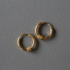 Delicate minimal gold plated sterling silver jewelry. Our products are made with 925 sterling silver and are hypoallergenic and nickel free! ★ This listing is for a PAIR of hoops.  ★ Hoop dimensions 10mm outer diameter, 8mm inner diameter  1.2mm thickness ★ Material 925 sterling silver  18k gold plating Your earrings will come in a cute gift box! We will ship them out asap, shipping is fixed price for as many items as you want. Everyday Simple Gold Jewelry, Gold Sterling Silver Hoop Earrings For Everyday, Minimalist Gold Plated Hoop Earrings Hallmarked, Everyday Gold Sterling Silver Hoop Earrings, Gold Hypoallergenic Jewelry For Everyday, Minimalist Hypoallergenic Jewelry For Everyday Use, Minimalist Everyday Earrings, Simple Gold Huggie Jewelry, Gold Simple Design Huggie Jewelry