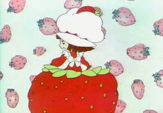 a cartoon character is sitting on top of a strawberry with lots of strawberries all around