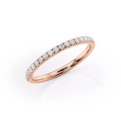 a rose gold wedding band with white diamonds