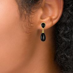 Dress up your look in sophisticated style with these pear-shaped black onyx double teardrop earrings in gold-plated silver. Fashioned in sterling silver with 14K gold plate Each drop showcases a 14.0 x 8.0mm pear-shaped rich black onyx dangle suspended from an inverted bezel-set pear-shaped onyx post. These earrings secure comfortably with friction backs. Gold Gemstone Teardrop Earrings For Formal Occasions, Elegant Gold Teardrop Earrings With Gemstone, Elegant Onyx Drop Jewelry, Elegant Pear-shaped Drop With Polished Finish, Gold Teardrop Gemstone Earrings, Elegant Teardrop Earrings With Polished Finish, Black Teardrop Earrings For Formal Occasions, Elegant Black Teardrop Earrings, Elegant Black Teardrop Earrings In Sterling Silver