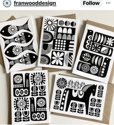 four black and white paper cut art pieces on top of a brown envelope with the words framewood design below it