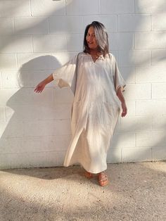 Flow in total comfort with our light cotton kaftan. This kaftan is perfect for the beach, pool, resort and laid-back time at home. Crafted from quality soft and light 100% cotton, it offers an airy fit that's ideal for lounging and out and about. Its relaxed design and easy slip-on style make it your go-to choice for outdoor happenings and relaxed nights at home. Relaxed Fit Summer Loungewear Cover-up, Casual V-neck Relaxed Fit Kaftan, Flowy Beige Kaftan For Summer, Beige Flowy Kaftan For Summer, Summer Beige Flowy Kaftan, V-neck Relaxed Fit Kaftan For Vacation, Beachwear Kaftan With Short Sleeves In Relaxed Fit, Beachwear Kaftan With Short Sleeve And Relaxed Fit, Short Sleeve Relaxed Fit Kaftan For Beachwear