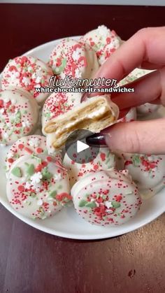 a person is cutting into some cookies on a plate