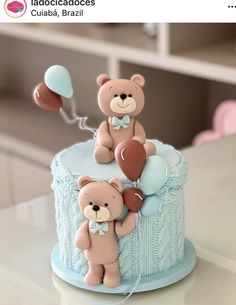 there is a cake decorated with teddy bears and balloons on the top one has a balloon in the shape of a bear