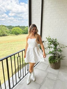 Women’s style and fashion, dress, white dress, wedding season, strapless dress, cowgirl boots, white outfit, nashville outfit, mini dress, party dress Bridal Cowgirl Outfit, White Cowgirl Boots Outfit, White Cowgirl Boots, Cowboy Boot Outfits, Cowgirl Boots Outfit, Nashville Outfits, White Boots, Cowgirl Outfits