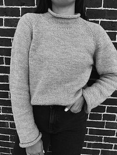 The Roll With Me Sweater Knitting Pattern is a women’s sweater featuring a classic rolled neck line and a slightly oversized boxy fit. It is knit from the top down and stitches for the sleeves and collar are picked up from the body. The pattern is available in sizes: XS(S)(M)(L)(XL)(XXL) and is meant to be worn with approx. 4-5 inches of positive ease.