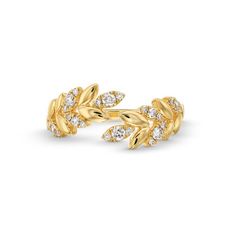 a gold ring with leaves and diamonds