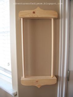 a wooden shelf hanging on the wall