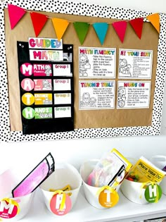 a bulletin board and some buckets on a table