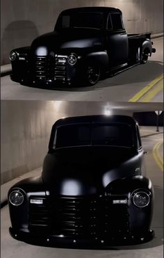 an old black pickup truck parked in a garage