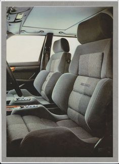 the interior of a vehicle with grey seats