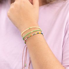 With a name that means "tropics" you can add a tropical touch to your look with this set of three Mix and Match Mea Bracelets. Featuring colors like green, cream, and multicolor Czech beads, you can mix and match these bad boys with other sets to create your own unique arm-candy. Tropics, anyone? 🌴 Green Friendship Bracelets With Colorful Beads For Vacation, Green Beaded Friendship Bracelet For Vacation, Green Summer Friendship Bracelets With Colorful Beads, Summer Green Friendship Bracelets With Colorful Beads, Trendy Green Friendship Bracelets With Colorful Beads, Handmade Green Beaded Bracelets For Vacation, Green Round Beads Friendship Bracelets For Summer, Green Bracelets With Colorful Beads For Beach, Summer Friendship Bracelets With Green Round Beads