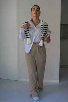 Classic Solid Collared Button Down | Color: White | True To Size - If Looking For A More Relaxed Fit, Size Up | Cuffed Wrists | 50% Polyester, 45% Nylon, 5% Spandex | Hand Wash Cold, Do Not Bleach Available in White and BlackALSO PICTURED- 'Alexandre' Classic High Waisted Trousers in Taupe- 'Yale' Classic Striped LS Sweater in Black and Ivory Muscle Tank Tops, Online Fashion Boutique, Retro Sunglasses, Muscle Tank, Muscle Tanks, High Waisted Trousers, Lower Back, Wide Leg Trousers, Fashion Boutique