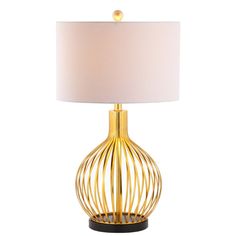 a gold table lamp with a white shade