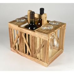 a wine bottle and two glasses in a wooden crate with glass inserts on the sides