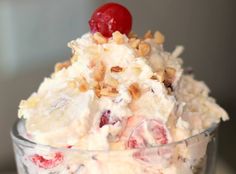 an ice cream sundae with cherries and nuts