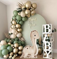 a baby's room with balloons and decorations in pastel green, gold and white colors