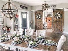 the dining room table is set with place settings