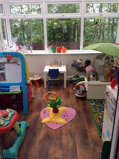 a child's playroom with toys and other items in the room on the floor