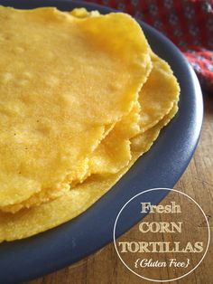 two corn tortillas on a blue plate