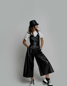 Culotte jumpsuit made of faux leather. Wrap front, zipper and button fastening. 2 front pockets. Adjustable straps.Product measurements, in:XS waist 23,6-25,2 in, hips 35.2-36.4 inS waist 25,6-26,8 in, hips 36.8-38.4 inM waist 27,2-28,7 in, hips 38,2-39,8 in ML waist 29,1-30,3 in, hips 40,2-41,7 in L waist 30,7-31,5 in, hips 42,1-43,7 inProduct measurements, cm:XS waist 60-64 cm, hips 88-91 cmS waist 65-68 cm, hips 92-96 cmM waist 69-73 cm, hips 97-101 cmML waist 74-77 cm, hips 102-106 cmL waist Black Leather Jumpsuits And Rompers, Leather Jumpsuits And Rompers For Fall, Seven Eleven, Culotte Jumpsuit, Fast Fashion, Fashion Store, Front Zipper, Fashion Models, Adjustable Straps