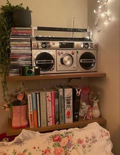 an old radio is on top of a book shelf