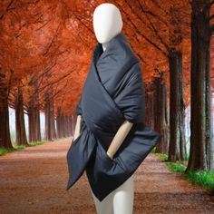 Long wide quilted nylon puffer scarf 80×20 inches with 2 pockets. The size of the mannequin in the photo (size S): Bust - 34.5 inch, Waist - 24.7 inch, Hips - 35.7 inch. This warm cape on the shoulders is handmade from waterproof windproof nylon. The synthetic insulation inside gives a fluffy shape and makes the shawl incredibly warm, comfortable and cozy even in the coldest season. And its laconic design allows you to feel original and stylish. Despite its volume, the scarf is very light and so Puffer Kimono, Quilted Shawl, Puffer Scarf, Winter Puffer Jackets, Blanket Shawl, Puffy Coat, Winter Quilts, Hooded Scarf, Handmade Scarves