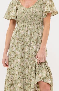 A charming floral midi dress features a smocked bodice framed by fluttery sleeves for whimsical style. 48" length Slips on over head V-neck Short sleeves Partially lined 100% polyester Hand wash, dry flat Imported Feminine Elegance, Short Sleeve Midi Dress, Sequin Wedding, Midi Shift Dress, Whimsical Fashion, Midi Short Sleeve Dress, Flounce Sleeve, Dress 16, Sleeve Midi Dress