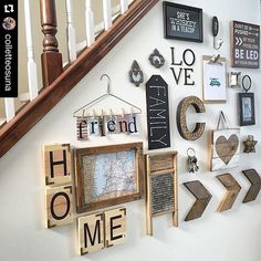 the wall is filled with wooden letters and magnets that spell out home, love, and other things